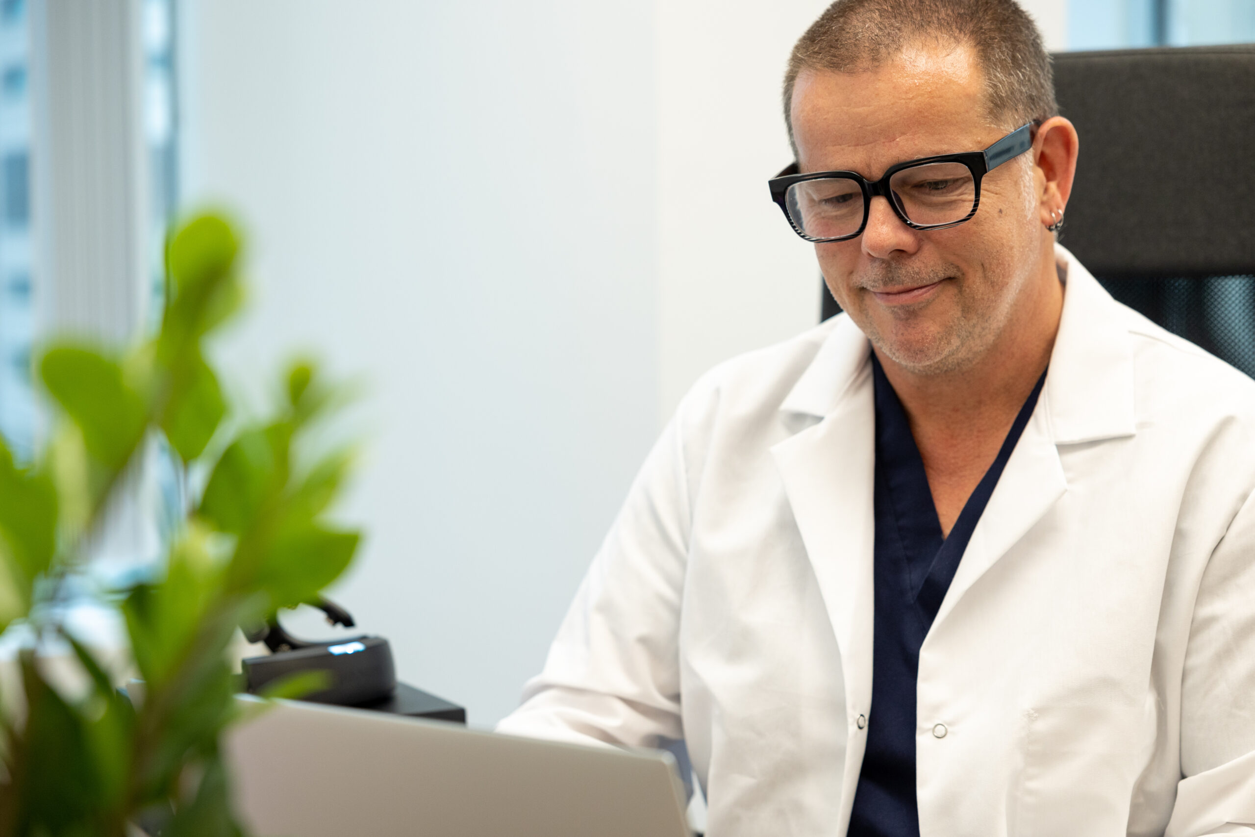 Therapist Working on Laptop