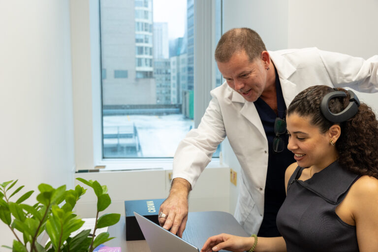 Therapist Working with Patient - Crown and Laptop