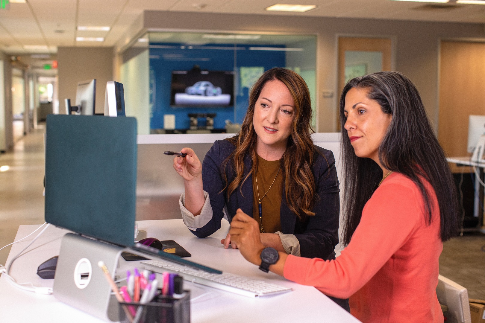 Two Women Collaborating at Desktop Computer