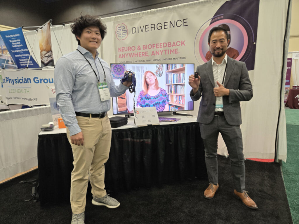 Alex Ni and Tony Ni Holding Synchroni Trio Cap