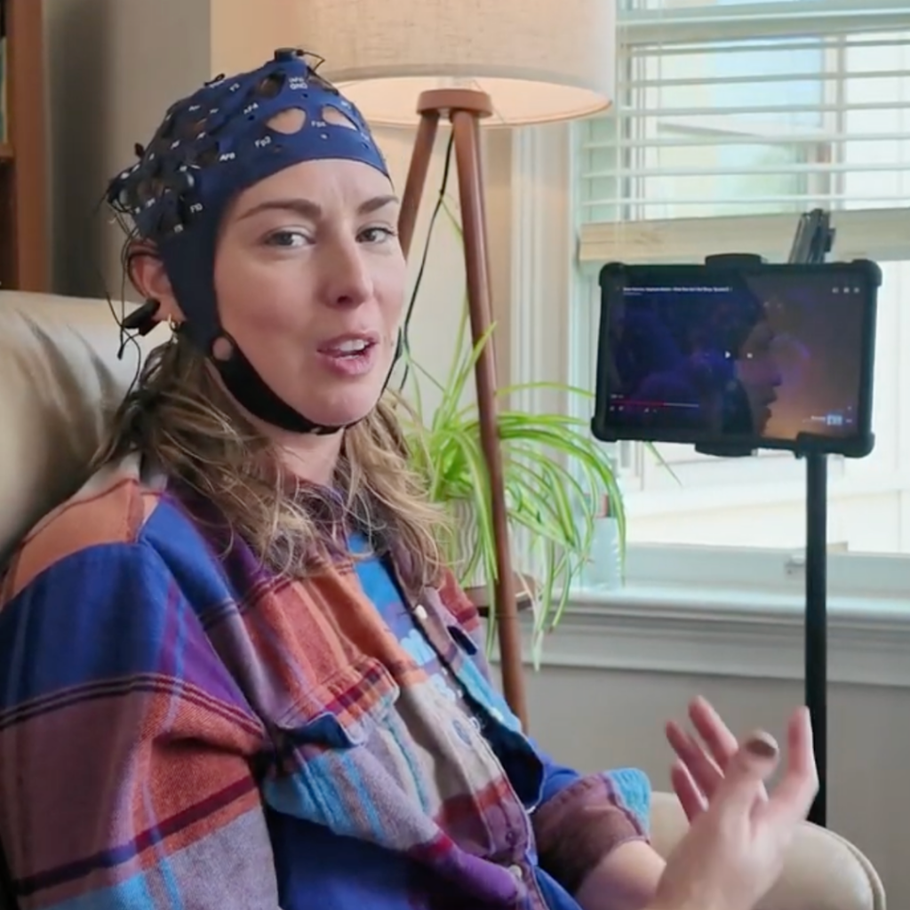 Leanne Wearing Synchroni Cap using Divergence Mobile App on Tablet