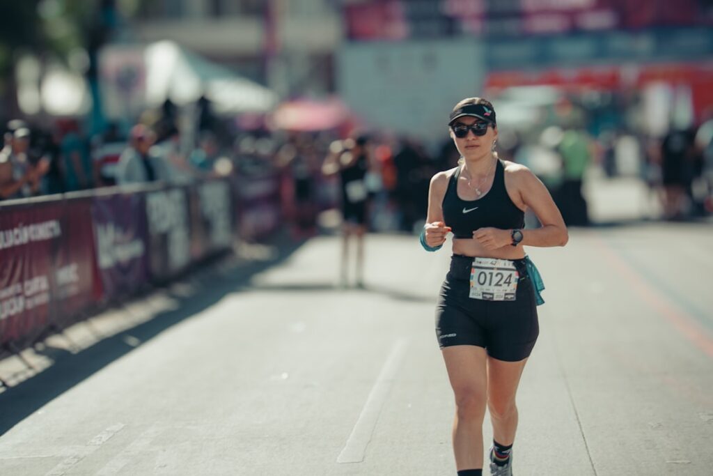 A focused woman running a marathon
